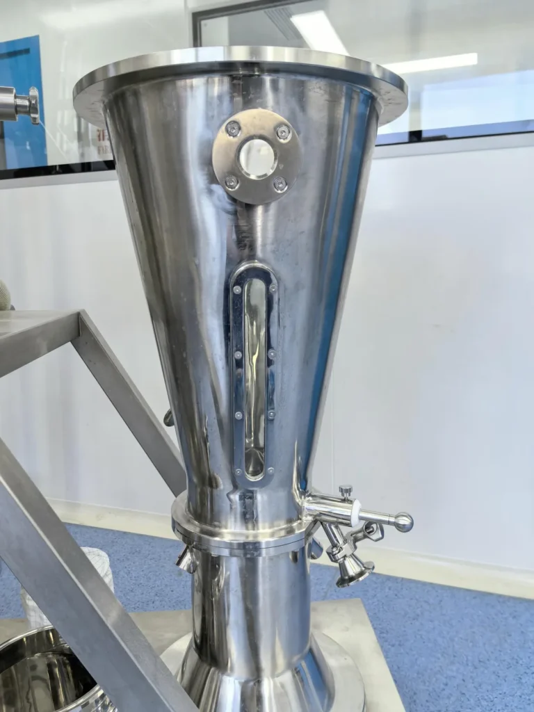 Wurster partition plate inside bottom spray fluid bed