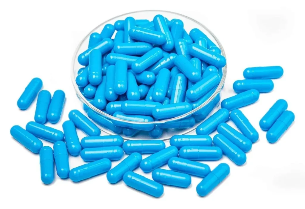 Colorful vegetable empty capsules pile on white background